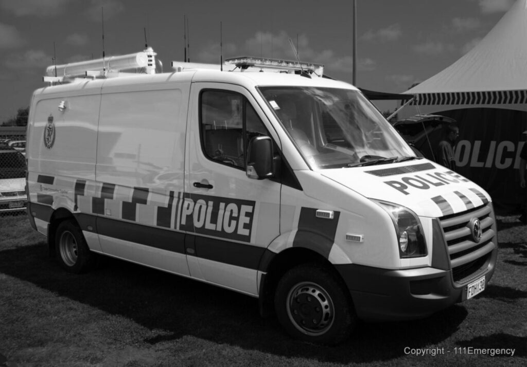 Black and white image of police van